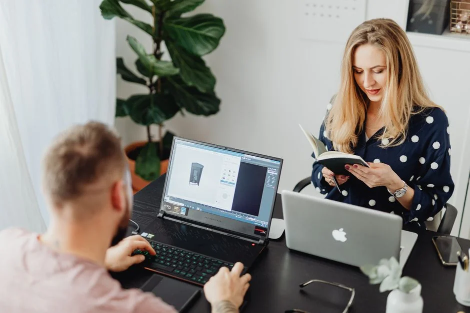 Overhead view of a diverse team collaborating on a project in a modern office setting.